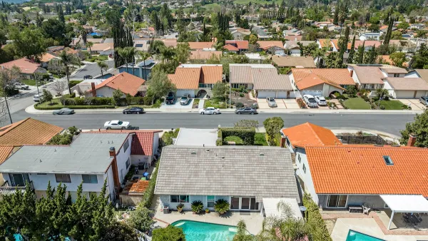 Aerial view of single-family homes with swimming pools in San Diego, California.